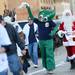 A Detroit fan dressed as Gumby swings his rally towel as he crosses Woodward in downtown Detroit before the start of Game 4 of the ALCS against the Yankees in Detroit on Thursday. 
